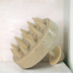 Sovintage Care stimulating scalp brush with soft bristles for scalp massage and hair scalp stimulation, shown in close-up image.